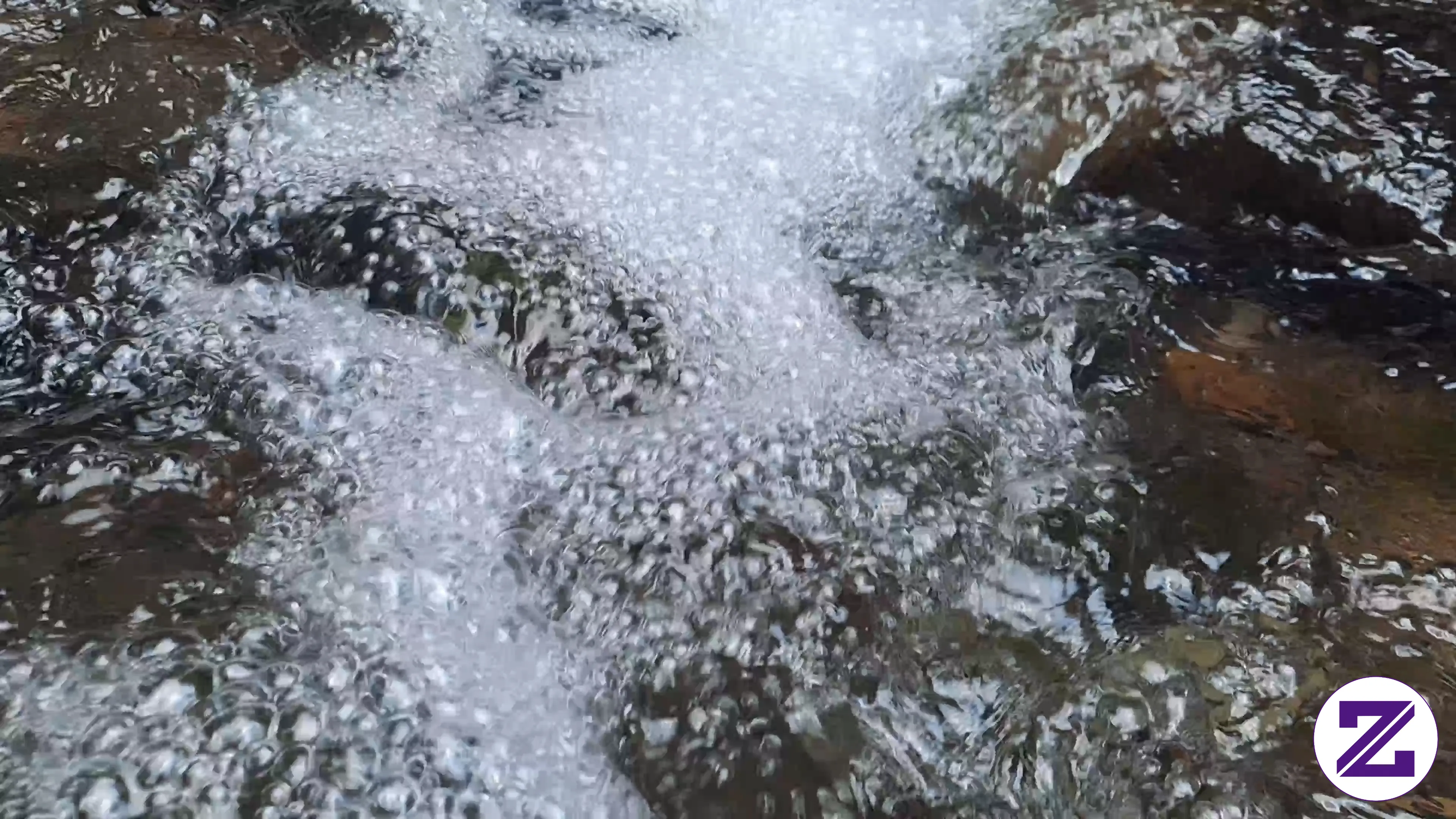 Clear Mountain Stream Flowing Over Natural Rocks